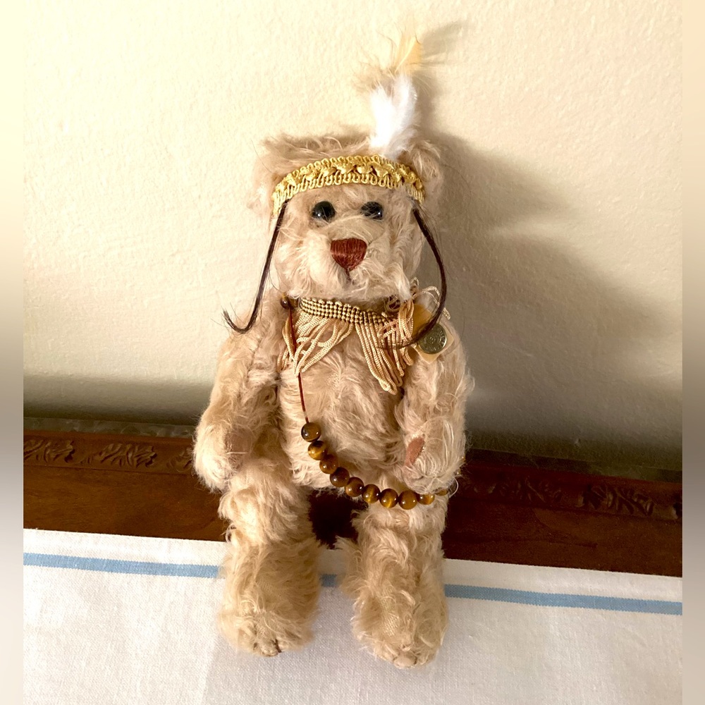 Vintage and collectible pickford bear “courage” with brass button.